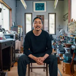 portrait of a japanese jeweler and silversmith in his workshop in japan