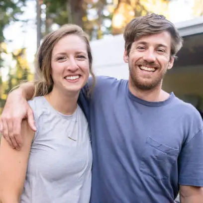 young couple living van life in the wilderness
